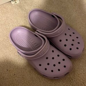 Light purple crocs.